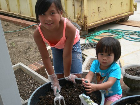 Kasen and Karis helping plant flowers